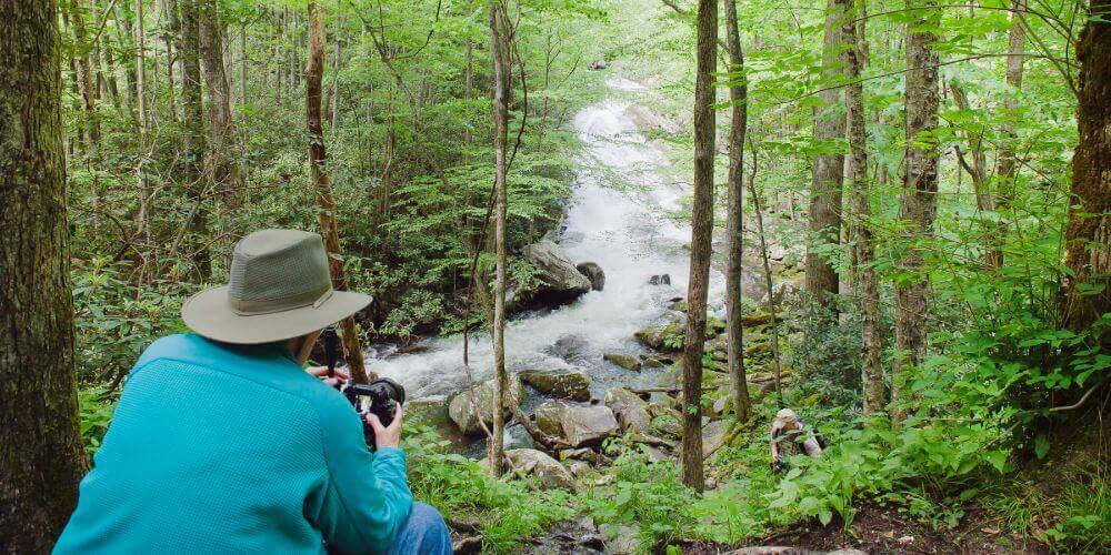 resident photographing the creek on the trails at maryville