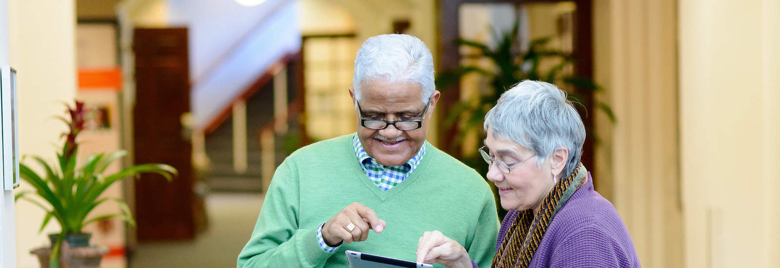 Senior living residents using an ipad